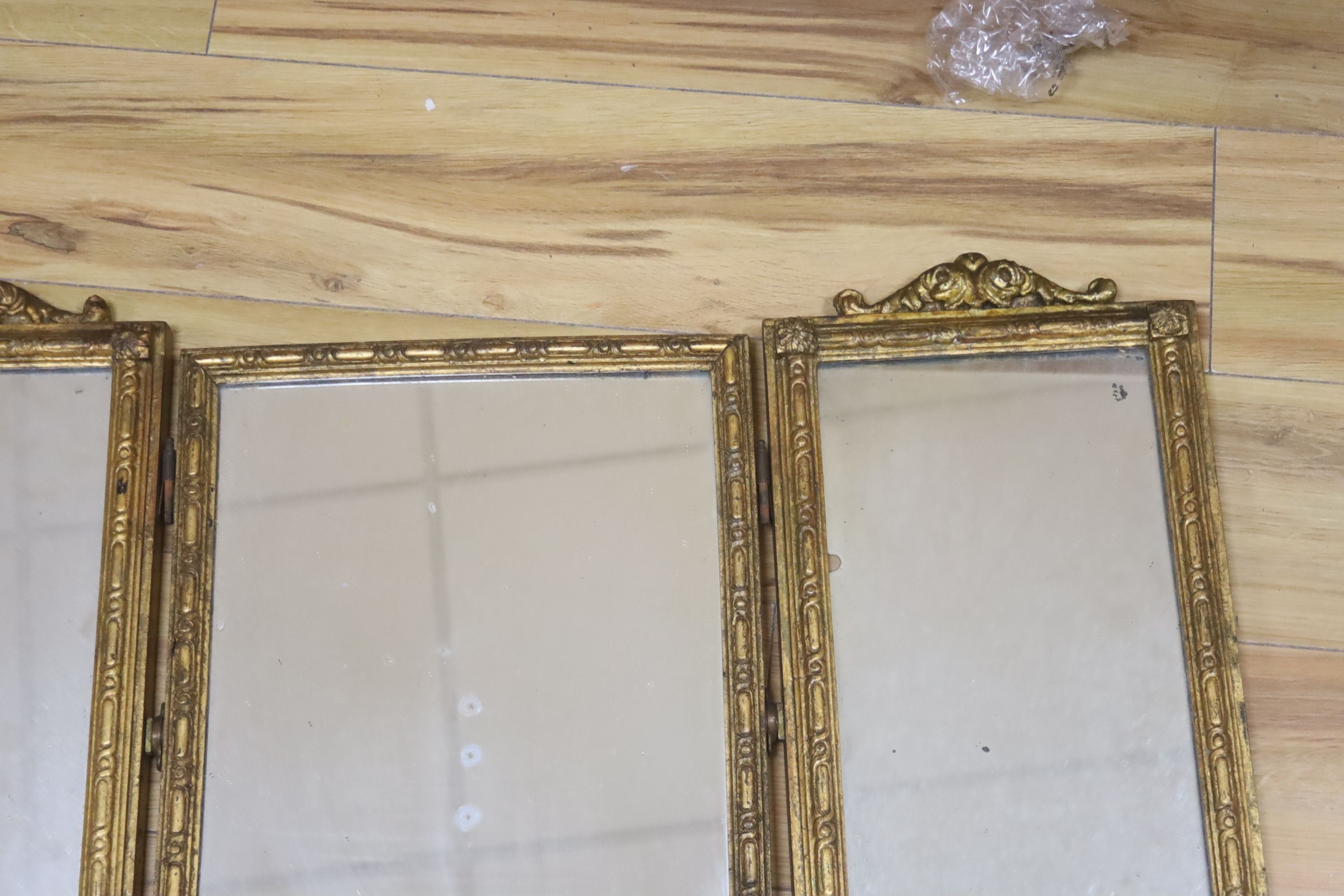 A gilt triptych mirror a.f